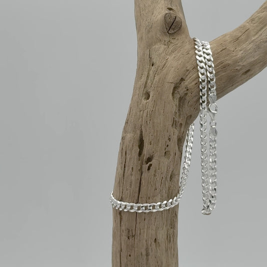 Platte zilveren gourmet ketting, 5,5 mm breed van 925 zilver. Platte schakel met subtiele glans en stijlvolle uitstraling voor elke dag.